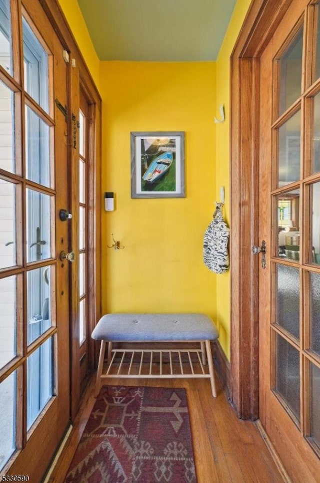 mudroom featuring wood finished floors, baseboards, and french doors