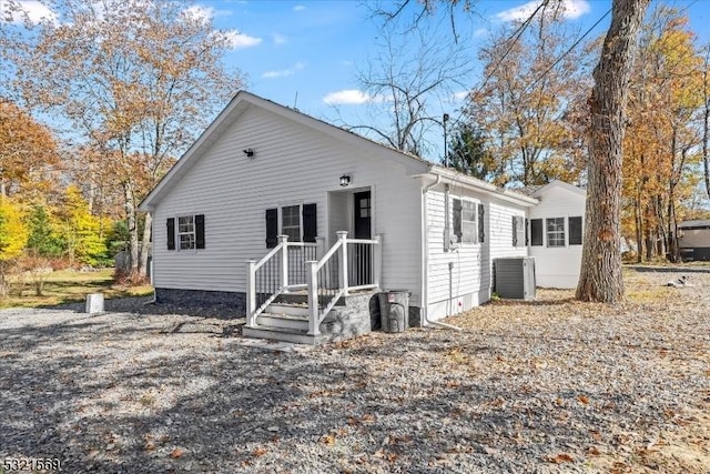 back of house featuring central AC unit