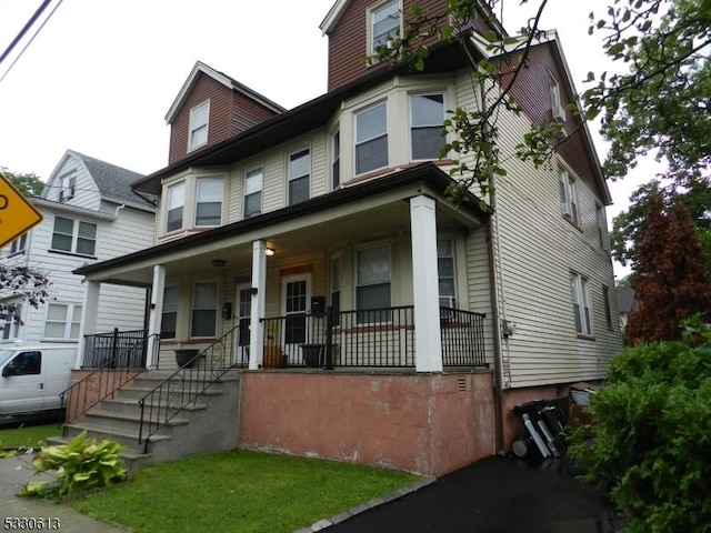 view of front of home featuring covered porch