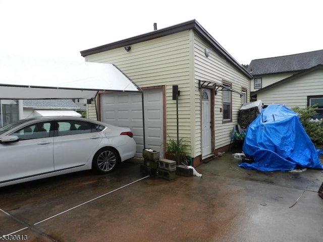 view of side of home featuring a garage