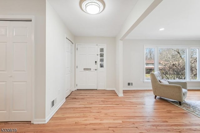 entryway with light hardwood / wood-style floors