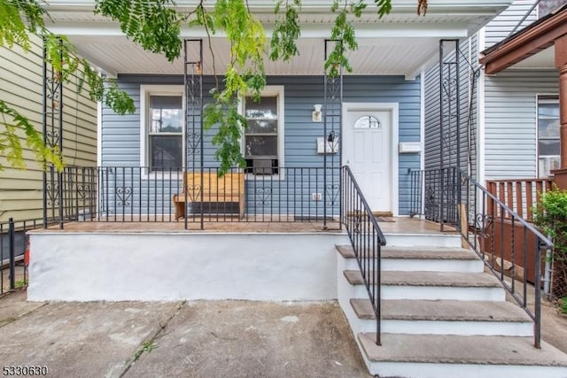 doorway to property featuring a porch