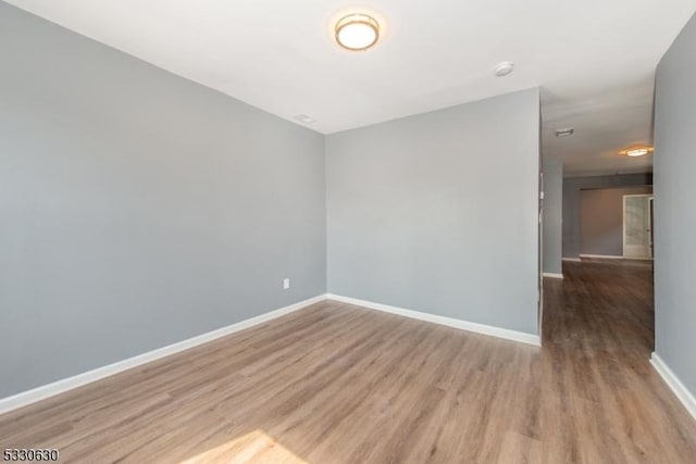 unfurnished room featuring hardwood / wood-style floors