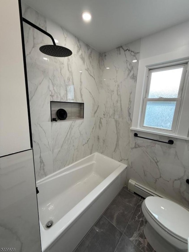 bathroom with toilet, tile walls, and a baseboard heating unit