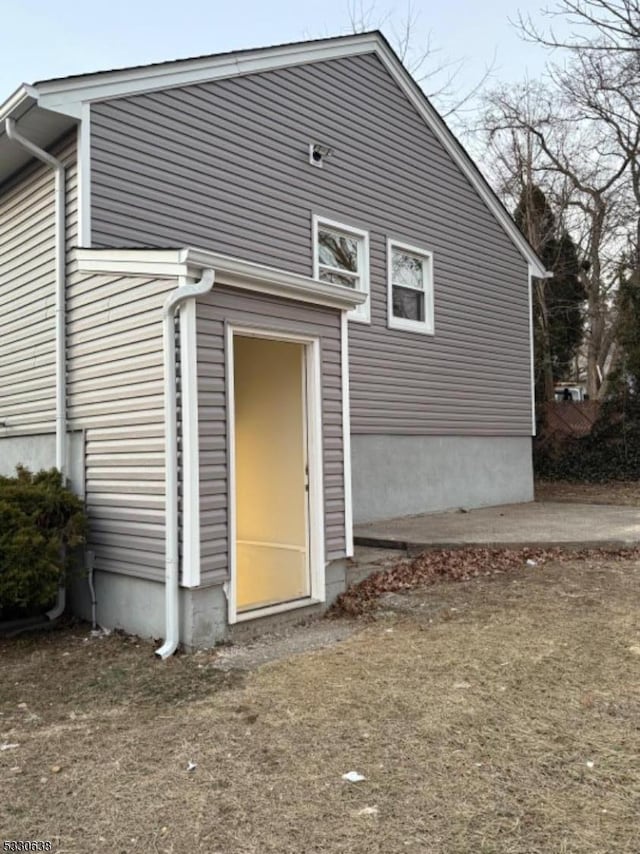 rear view of property featuring a patio