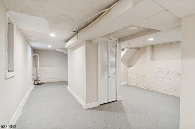 finished basement featuring baseboards and recessed lighting