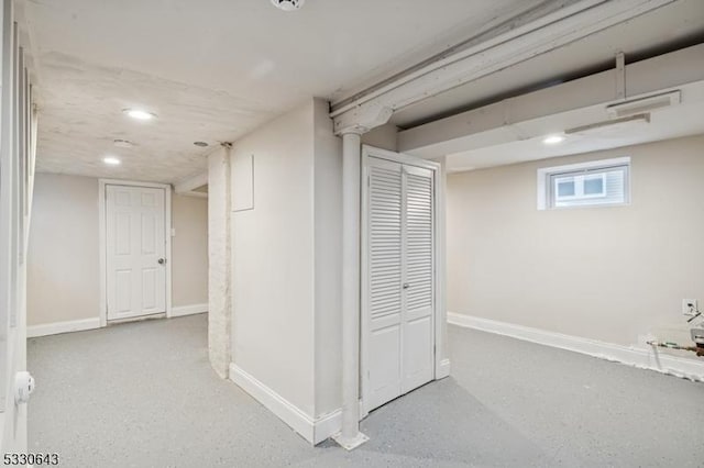 basement featuring recessed lighting and baseboards