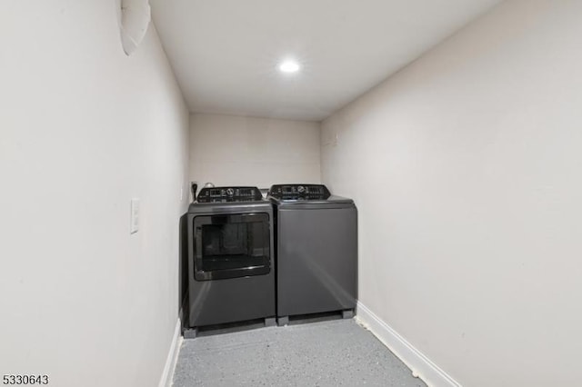 laundry room featuring washer and dryer, laundry area, baseboards, and recessed lighting