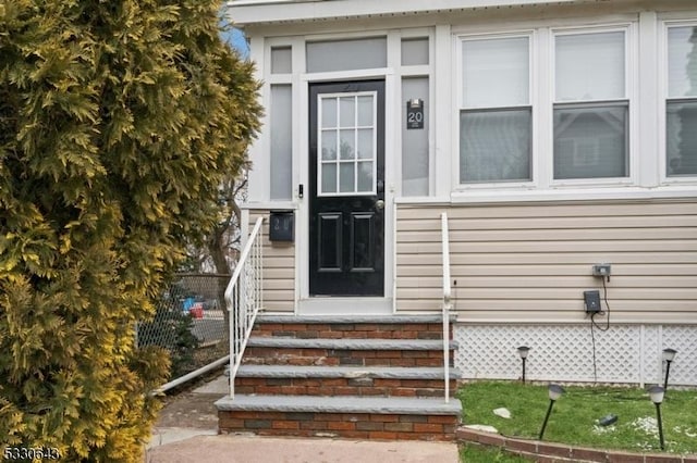 property entrance with brick siding