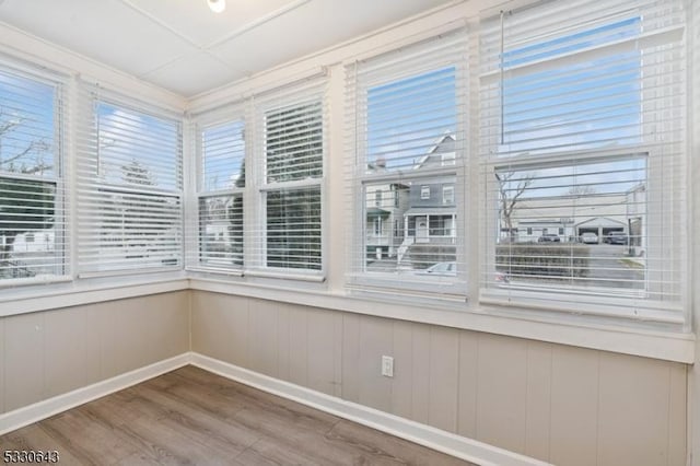 unfurnished sunroom featuring plenty of natural light