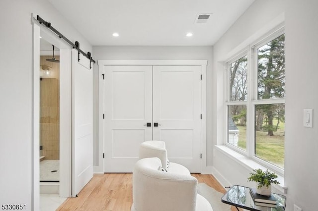 bathroom featuring hardwood / wood-style floors and a wealth of natural light