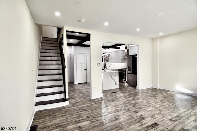 unfurnished living room with wood-type flooring