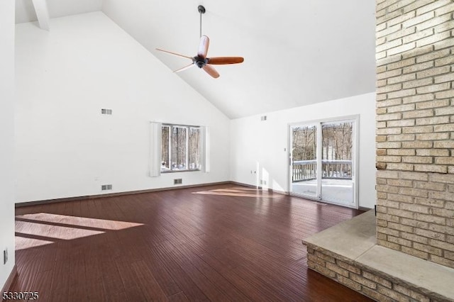 unfurnished living room with dark hardwood / wood-style flooring, high vaulted ceiling, and ceiling fan