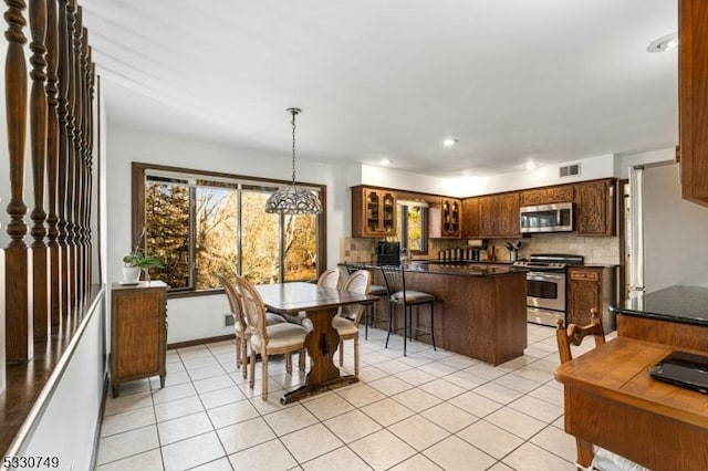 dining area with light tile patterned floors