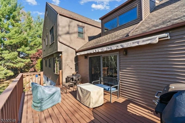 wooden deck featuring area for grilling