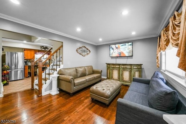 living room featuring hardwood / wood-style floors and crown molding