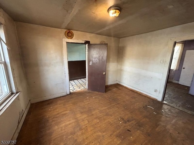 empty room featuring dark hardwood / wood-style floors