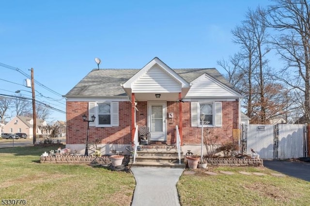 bungalow-style house with a front yard