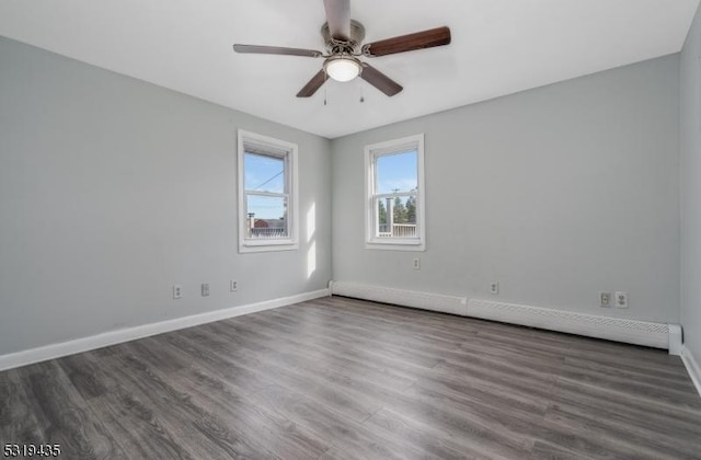 unfurnished room featuring dark hardwood / wood-style floors and ceiling fan