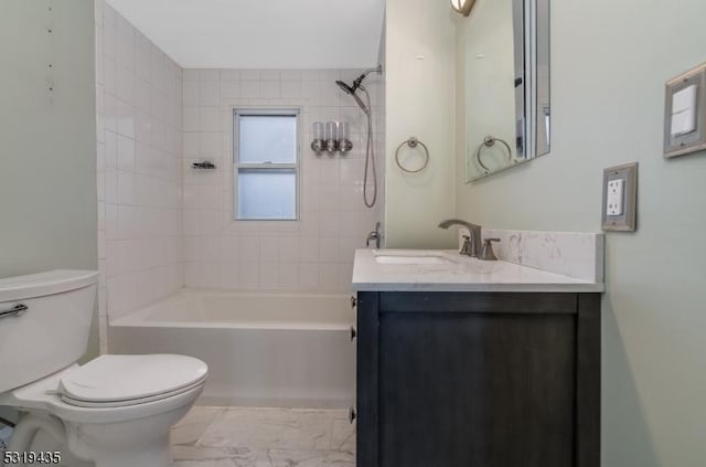 full bathroom with vanity, toilet, and tiled shower / bath