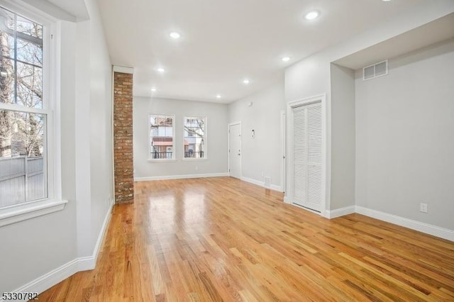 unfurnished living room with light hardwood / wood-style flooring