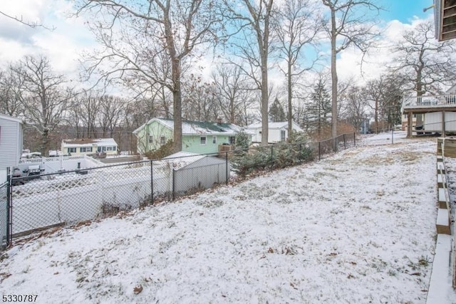 view of yard layered in snow