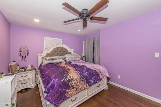 bedroom with ceiling fan and dark wood-type flooring