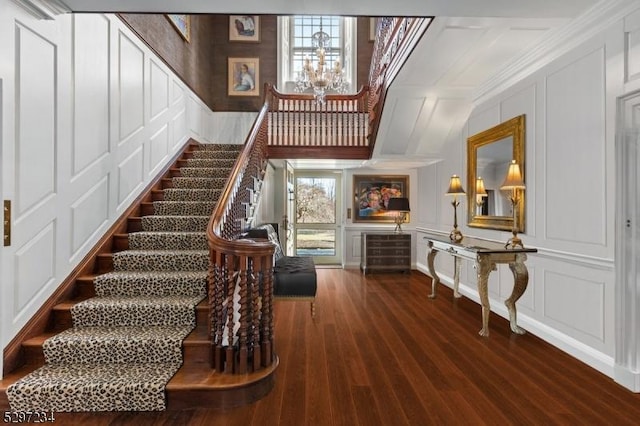 staircase featuring hardwood / wood-style flooring and a healthy amount of sunlight