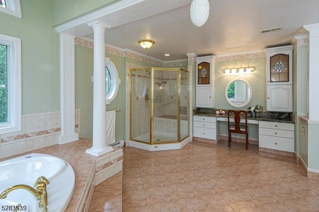 bathroom with vanity, a healthy amount of sunlight, and plus walk in shower