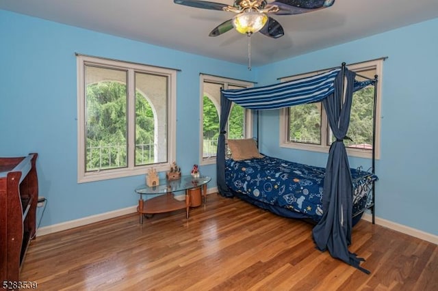 bedroom featuring ceiling fan and wood-type flooring