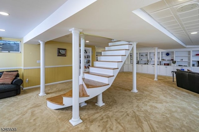 basement with carpet and built in shelves