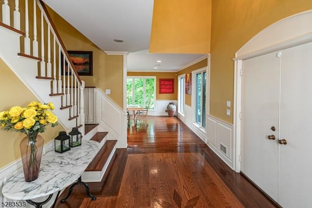 corridor featuring dark hardwood / wood-style floors and ornamental molding