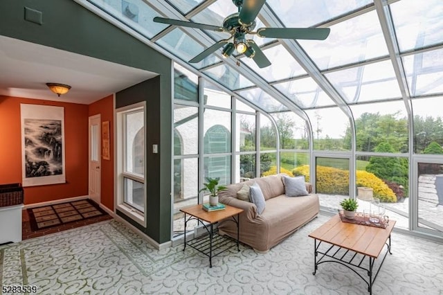 sunroom with ceiling fan and vaulted ceiling