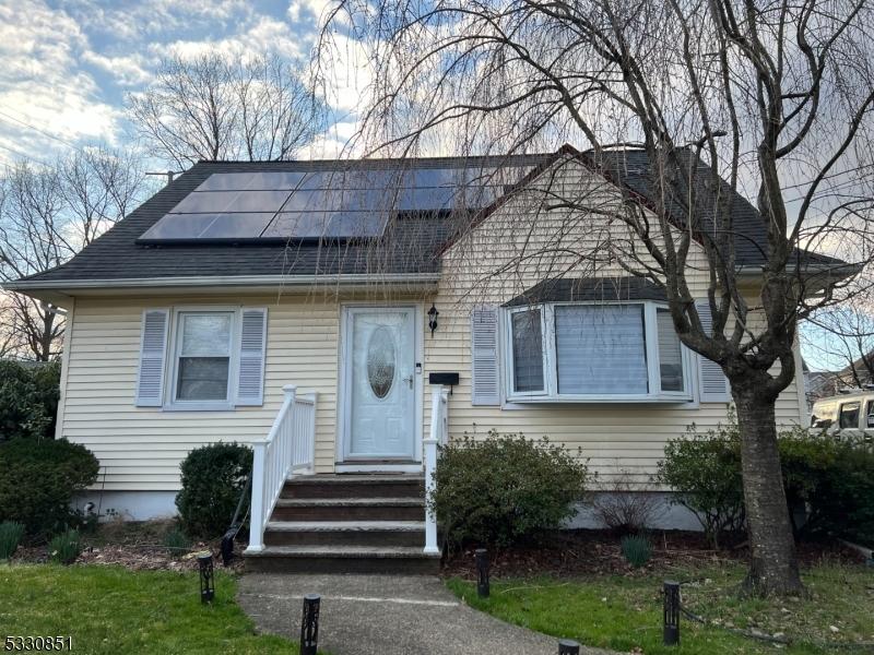 view of front of home featuring solar panels