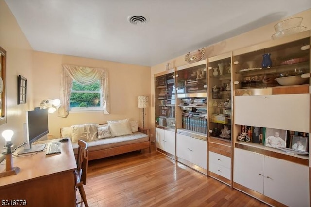 sitting room featuring light hardwood / wood-style flooring