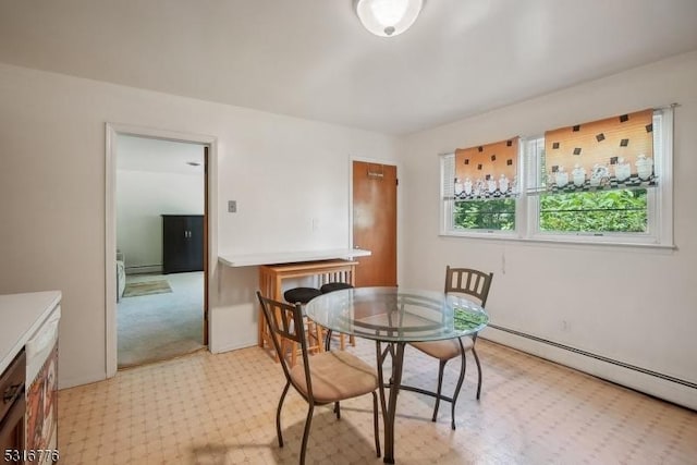 dining room featuring a baseboard heating unit