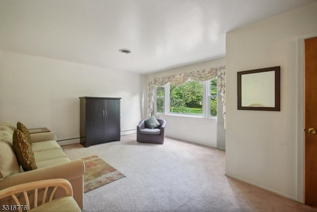 carpeted living room with a baseboard radiator