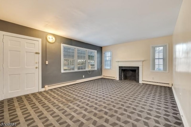 unfurnished living room with a fireplace and a baseboard radiator