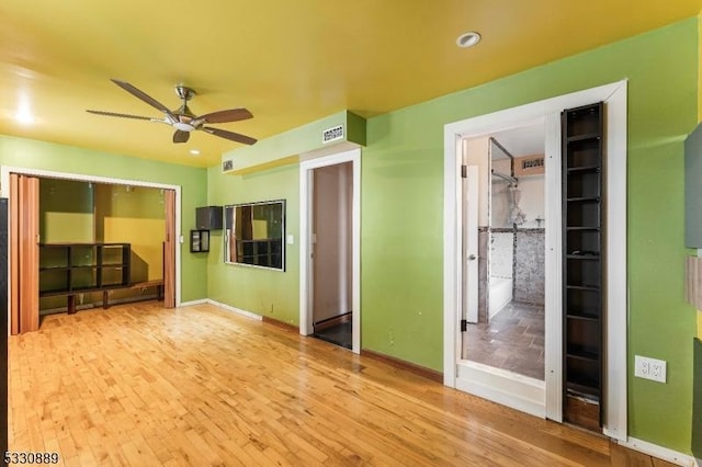 interior space with ceiling fan and light wood-type flooring