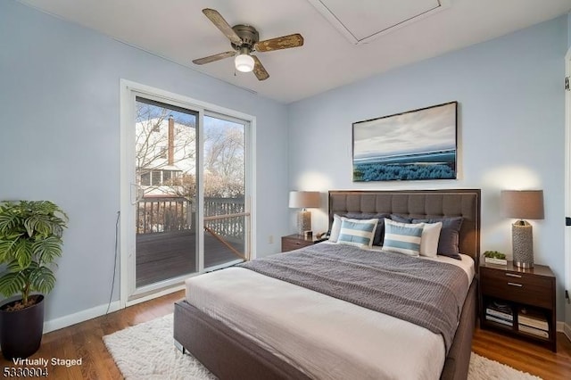 bedroom featuring access to outside, ceiling fan, and dark hardwood / wood-style floors