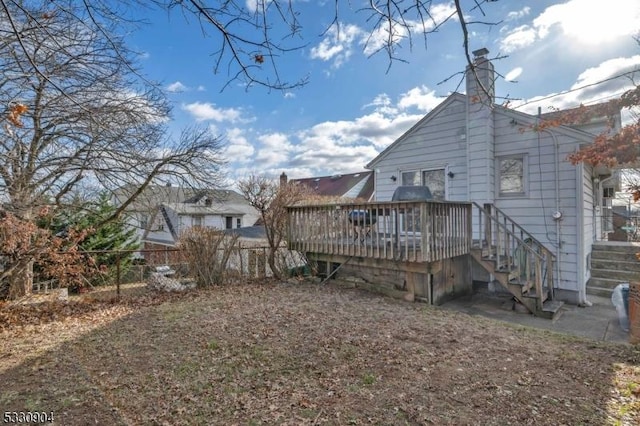 back of house with a wooden deck