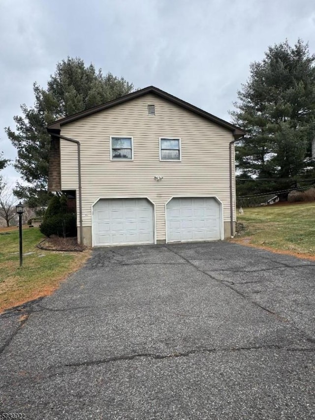 view of property exterior with a garage