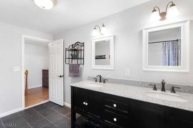 bathroom featuring tile patterned flooring and vanity