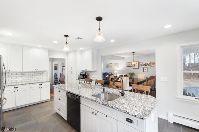 kitchen with dishwasher, a kitchen island with sink, sink, baseboard heating, and white cabinetry