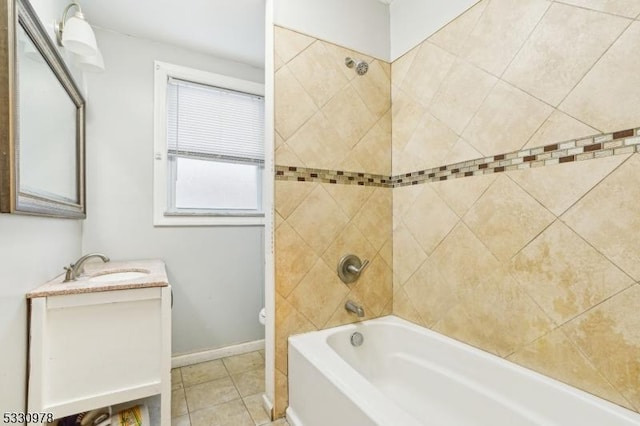 full bathroom with tiled shower / bath combo, vanity, toilet, and tile patterned flooring