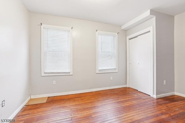 unfurnished bedroom featuring hardwood / wood-style floors