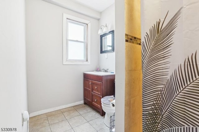 bathroom featuring walk in shower and vanity