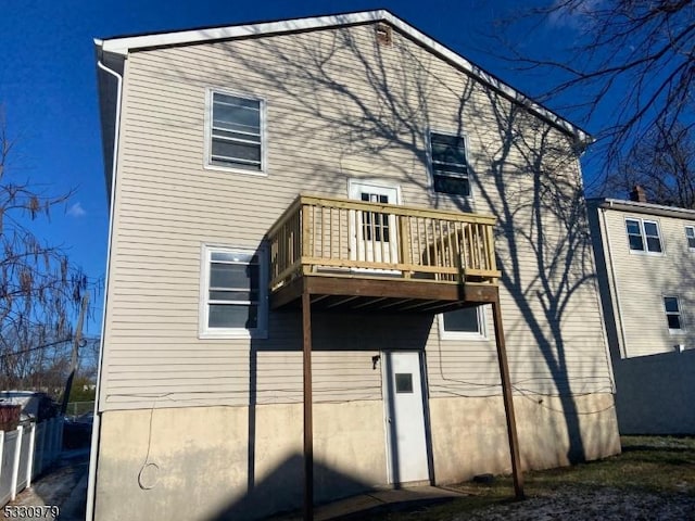 rear view of house with a balcony