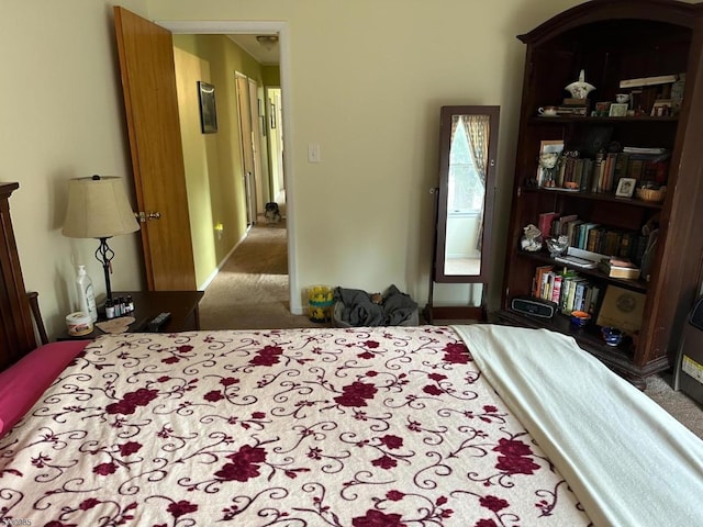 bedroom featuring dark carpet