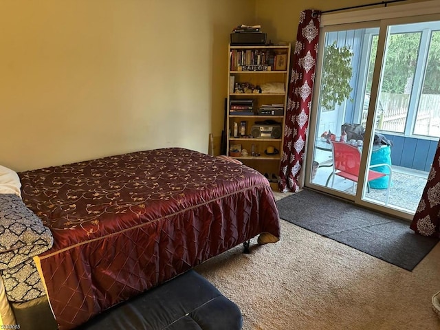 carpeted bedroom with access to exterior